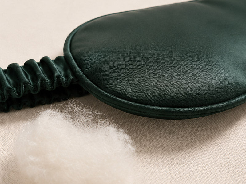 Close-up of the finished edge and silk-wrapped strap of the sleep mask