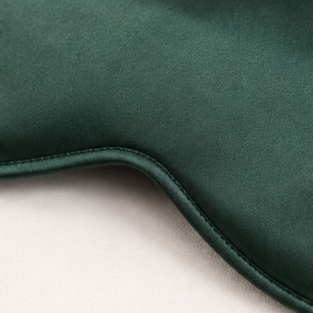 Close-up of the curved edge stitching on a silk sleep mask