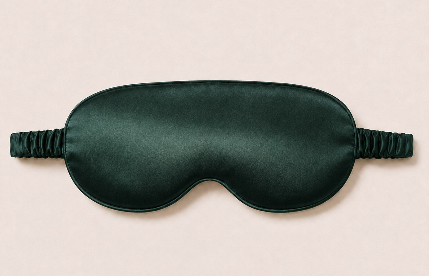 Forest Whisper silk sleep mask shown flat with adjustable strap
