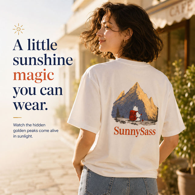 Woman wearing white Sunlit Peaks embroidered tee during golden hour