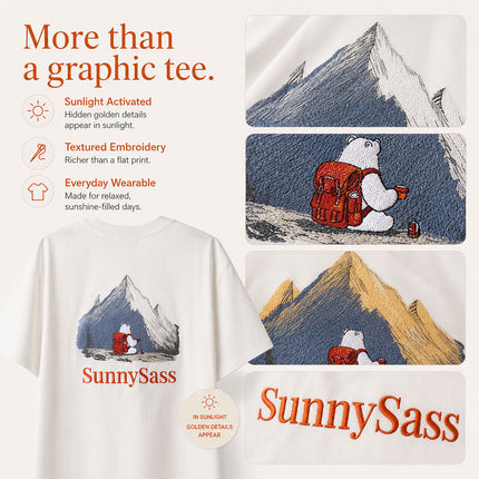 Close-up of mountain embroidery and sunlight-reactive thread on white tee