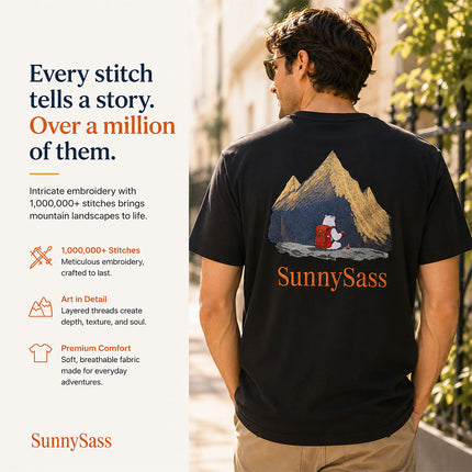 Golden mountain embroidery detail on black Sunlit Peaks T-shirt