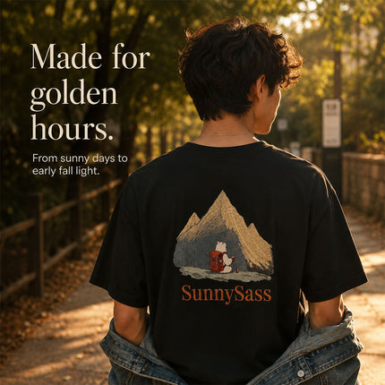Black embroidered graphic tee worn during warm early fall sunlight